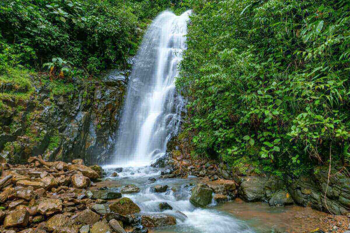 Flowing waterfall symbolizing the natural flow of money frequency and abundance.